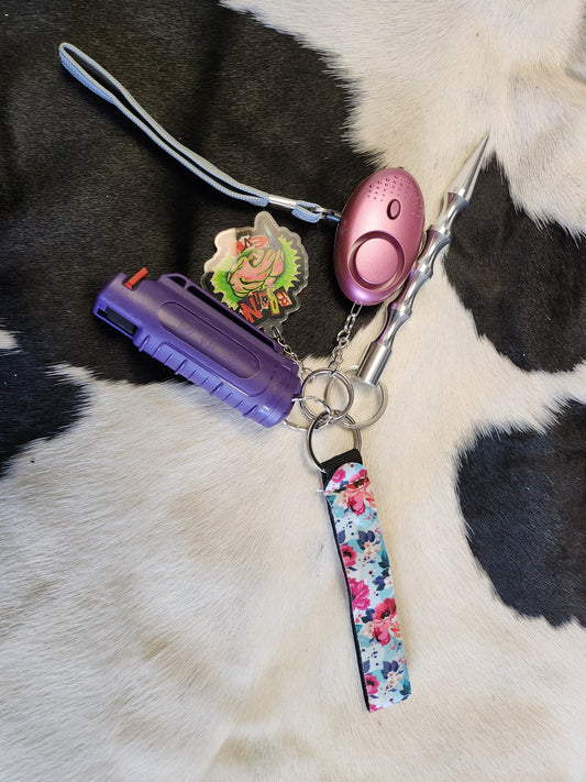 Self defensive keychain. Flowers with purple pepper spray