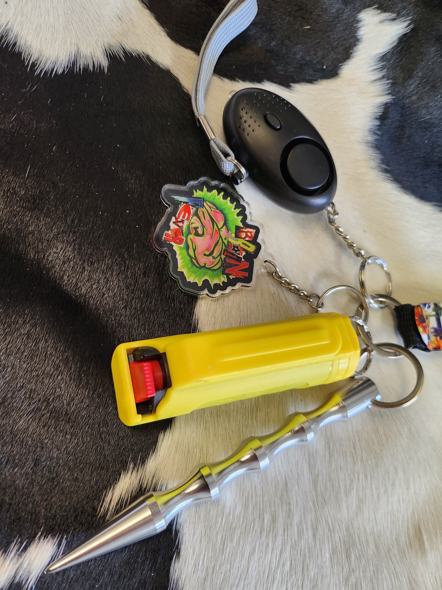 Self defense keychain with with sun flowers and yellowe pepper spray