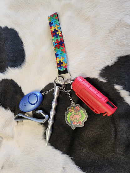 Self defense keychain with puzzle piece wristlet